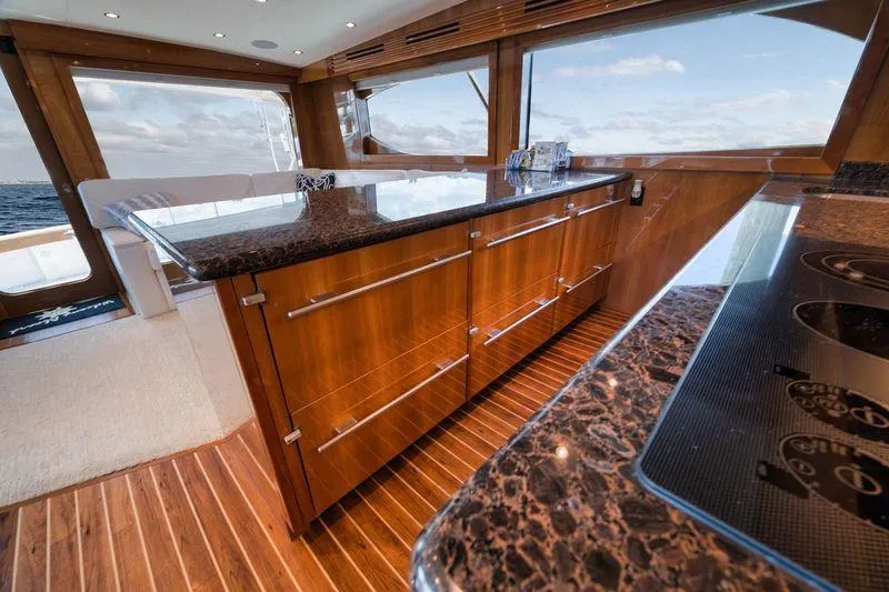Slide: The Image of Luxurious interior of 2009 Hatteras 60GT yacht with elegant wood and marble finishes. - 13