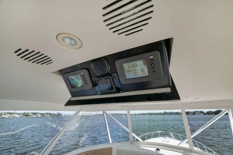 Slide: The Image of Hatteras 60GT 2009 yacht dashboard with navigation instruments and sea view. - 31