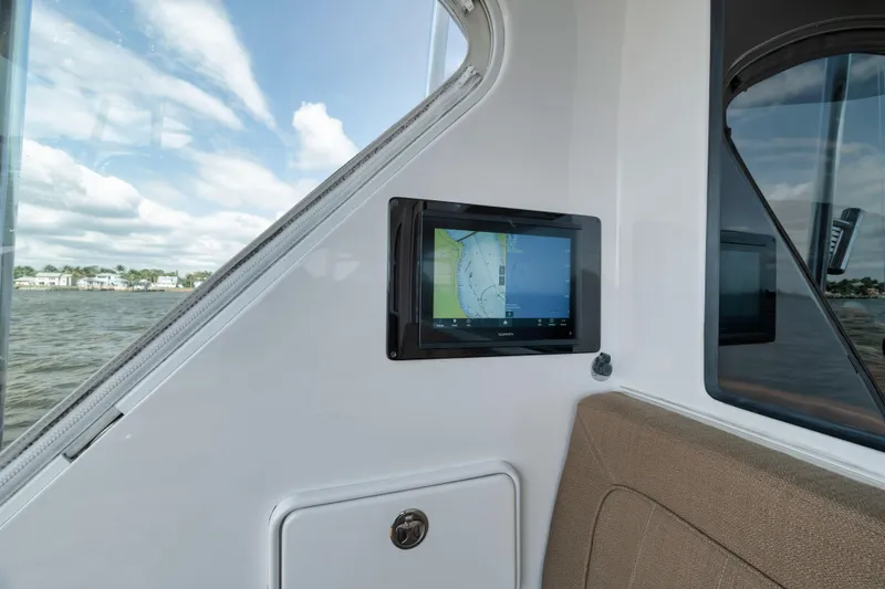 Slide: The Image of Hatteras 60GT 2009 boat interior with navigation screen and window view. - 37