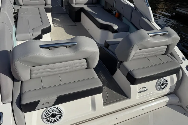 Slide: The Image of 2024 Regal LX9 boat interior with luxurious gray seating and modern design. - 14