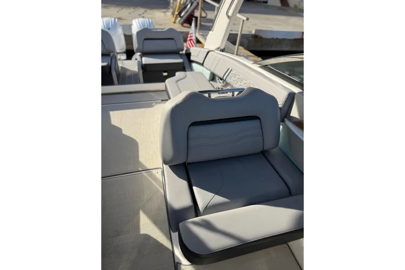 Slide: The Image of 2024 Regal LX9 boat interior with luxurious gray seating and modern design. - 17