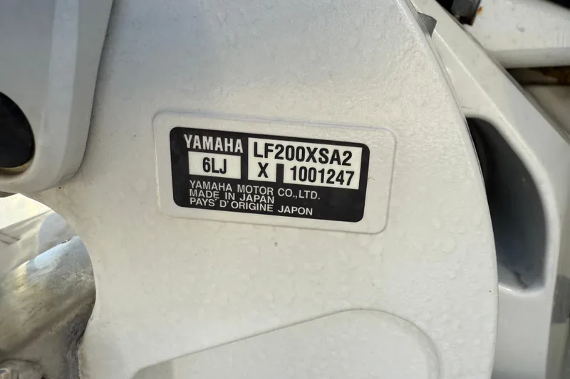 Slide: The Image of Label on Yamaha motor, model LF200XSA2, made in Japan, on 2024 Regal LX9. - 24