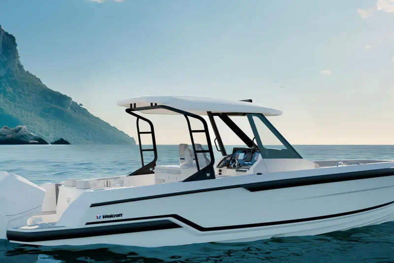 The Image of 2026 Wellcraft 28 T-Top boat on calm sea with coastal backdrop. - 0