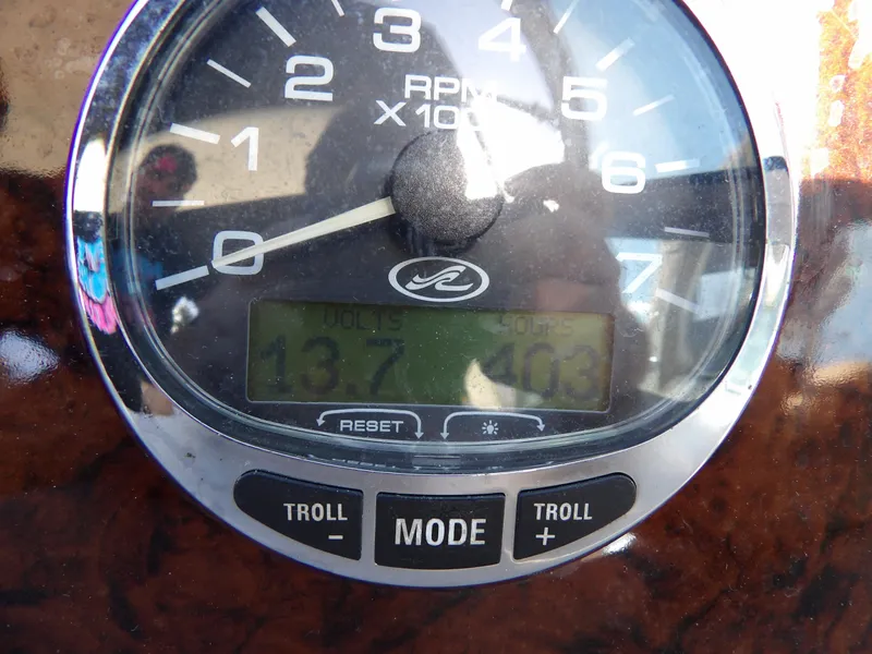 Slide: The Image of Close-up of 2004 Sea Ray 320 Sundancer RPM gauge displaying 137 RPM. - 22