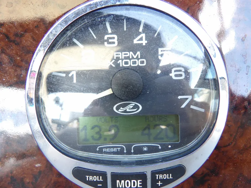 Slide: The Image of Close-up of 2004 Sea Ray 320 Sundancer tachometer displaying RPM and engine hours. - 23