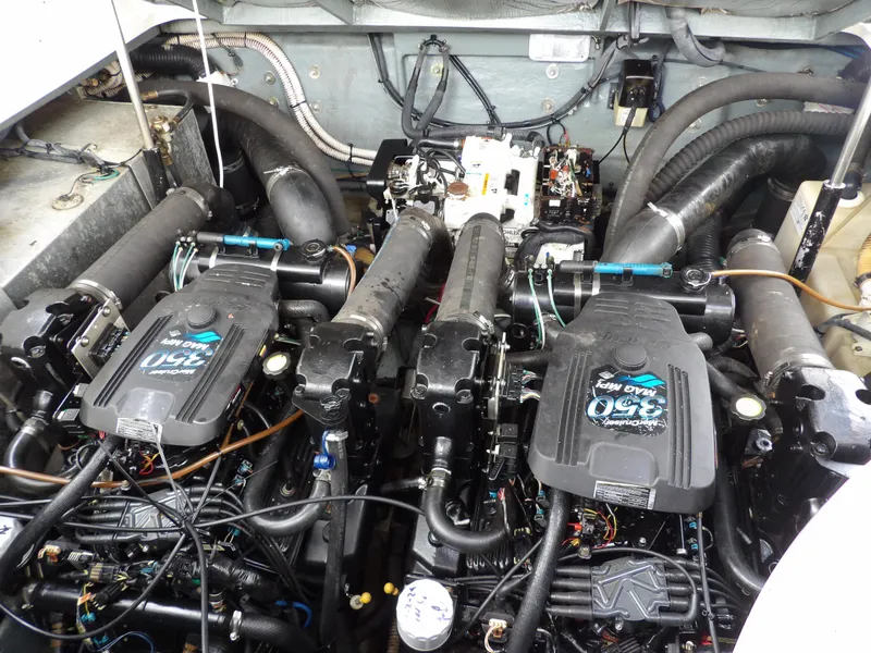 Slide: The Image of Engine compartment of 2004 Sea Ray 320 Sundancer with dual MerCruiser engines. - 29