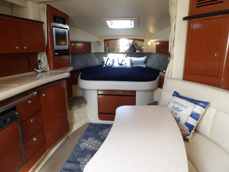 Slide: The Image of Interior of 2004 Sea Ray 320 Sundancer with cozy cabin and modern amenities. - 37