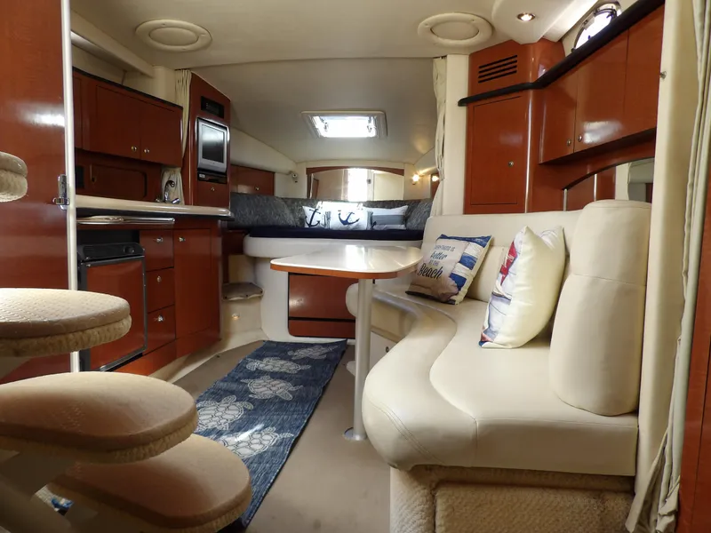 Slide: The Image of Luxurious interior of 2004 Sea Ray 320 Sundancer yacht with elegant seating and cabinetry. - 38