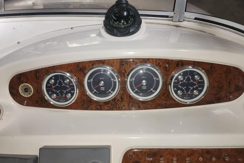 Slide: The Image of Dashboard of a 2004 Meridian 411 Sedan with gauges and compass. - 11