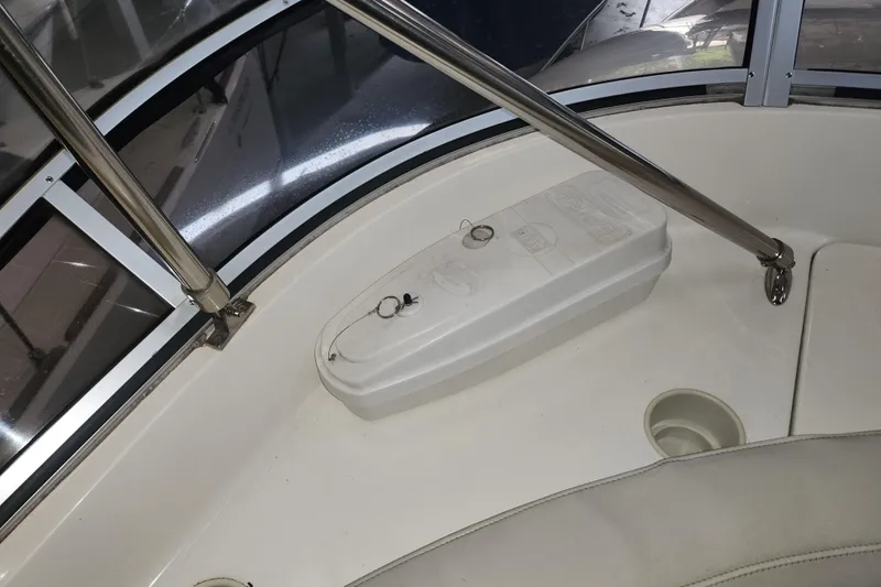 Slide: The Image of Interior view of a 2004 Meridian 411 Sedan boat, featuring a white control panel. - 13