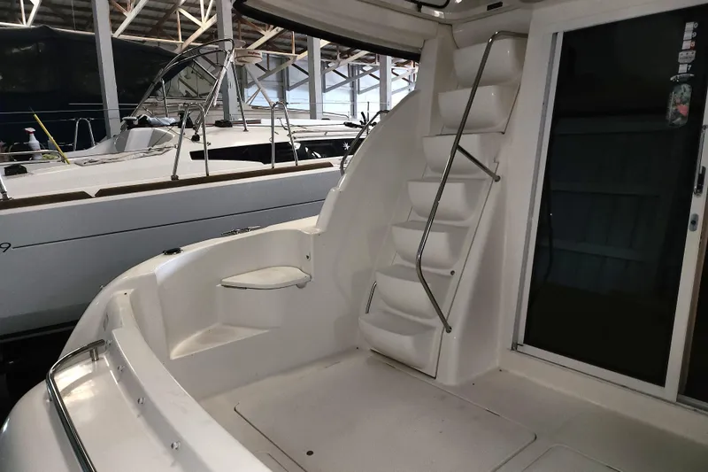 Slide: The Image of 2004 Meridian 411 Sedan yacht interior with stairs and seating area. - 14