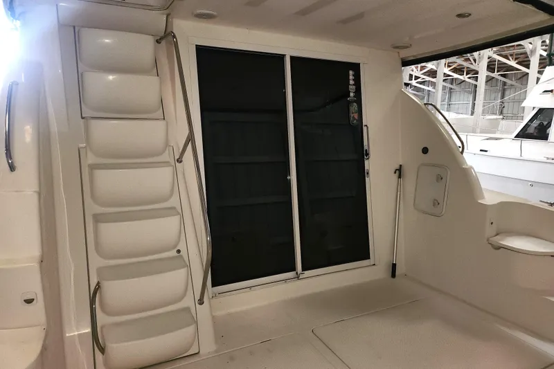 Slide: The Image of 2004 Meridian 411 Sedan yacht interior with stairs and sliding door. - 15