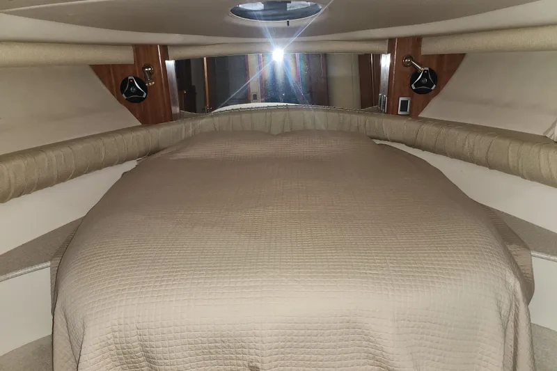 Slide: The Image of Interior cabin of a 2004 Meridian 411 Sedan yacht with a cozy bed. - 19