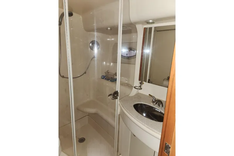 Slide: The Image of Bathroom interior of 2004 Meridian 411 Sedan yacht with shower and sink. - 21