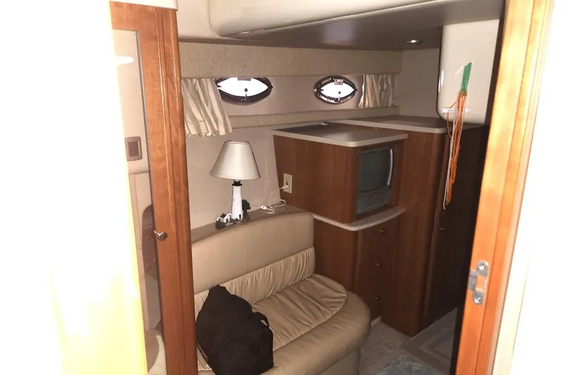 Slide: The Image of Interior of 2004 Meridian 411 Sedan yacht with cozy seating and vintage TV. - 22