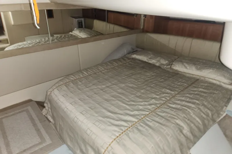 Slide: The Image of Luxurious bedroom interior of 2004 Meridian 411 Sedan yacht with elegant bedding. - 24