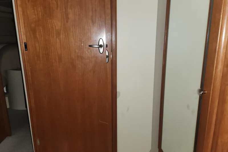 Slide: The Image of Wooden interior door of a 2004 Meridian 411 Sedan yacht. - 25