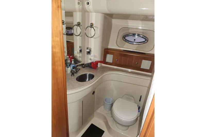 Slide: The Image of Bathroom interior of 2004 Meridian 411 Sedan yacht, featuring sink and toilet. - 27