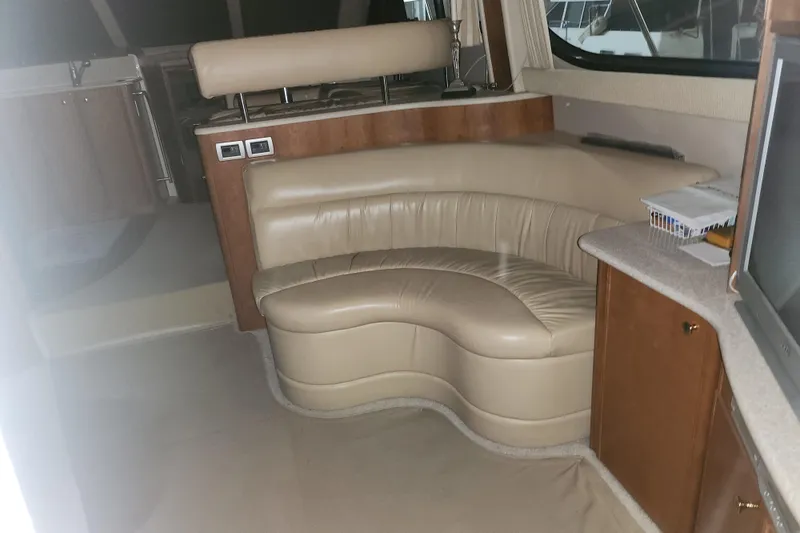 Slide: The Image of Interior of 2004 Meridian 411 Sedan with beige leather seating and wooden cabinetry. - 30
