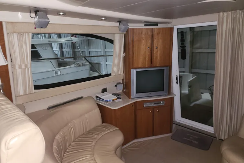 Slide: The Image of Interior of a 2004 Meridian 411 Sedan yacht with TV and seating area. - 33