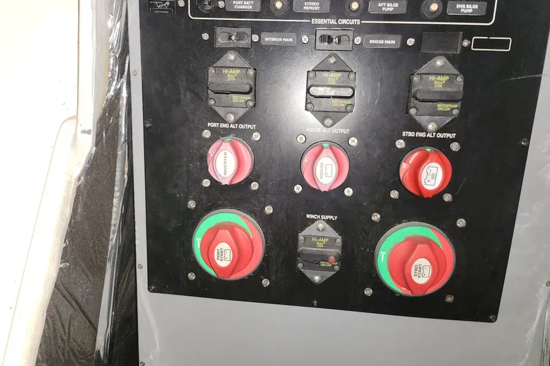 Slide: The Image of Control panel of a 2004 Meridian 411 Sedan boat with labeled switches and dials. - 37