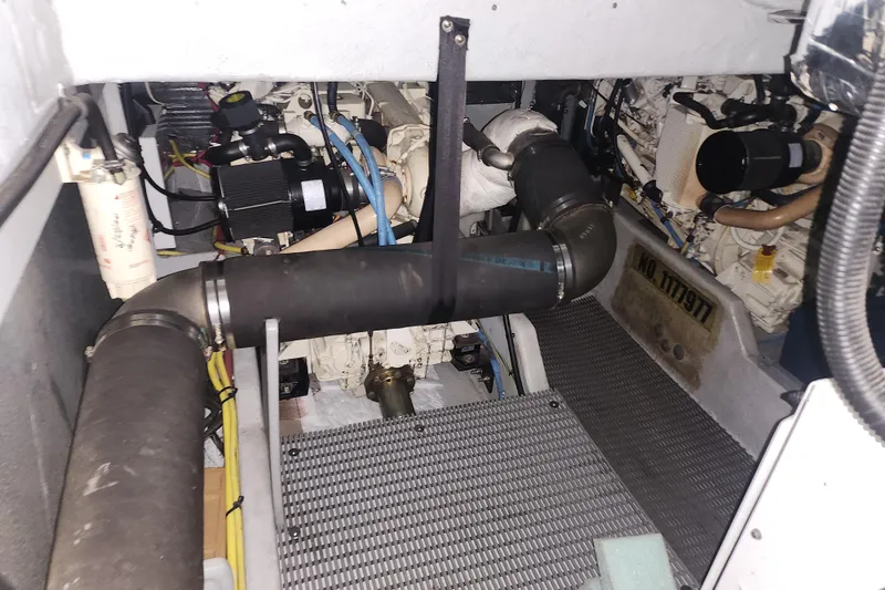 Slide: The Image of Engine room of a 2004 Meridian 411 Sedan boat, showcasing mechanical components. - 39