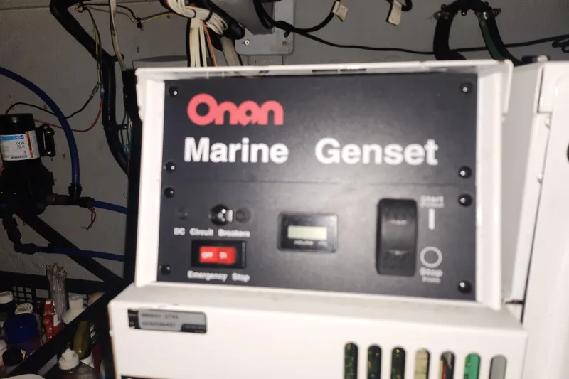 Slide: The Image of Onan Marine Genset control panel inside 2004 Meridian 411 Sedan yacht. - 40