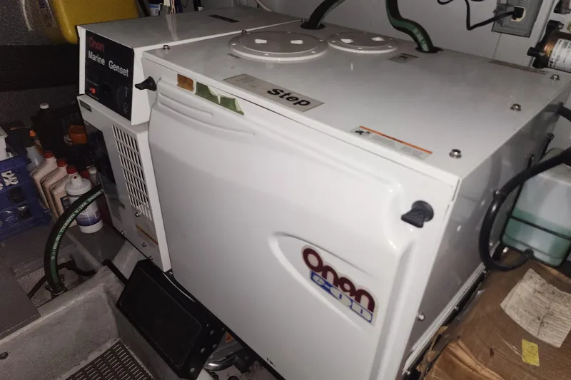 Slide: The Image of Onan marine generator in a 2004 Meridian 411 Sedan engine room. - 41