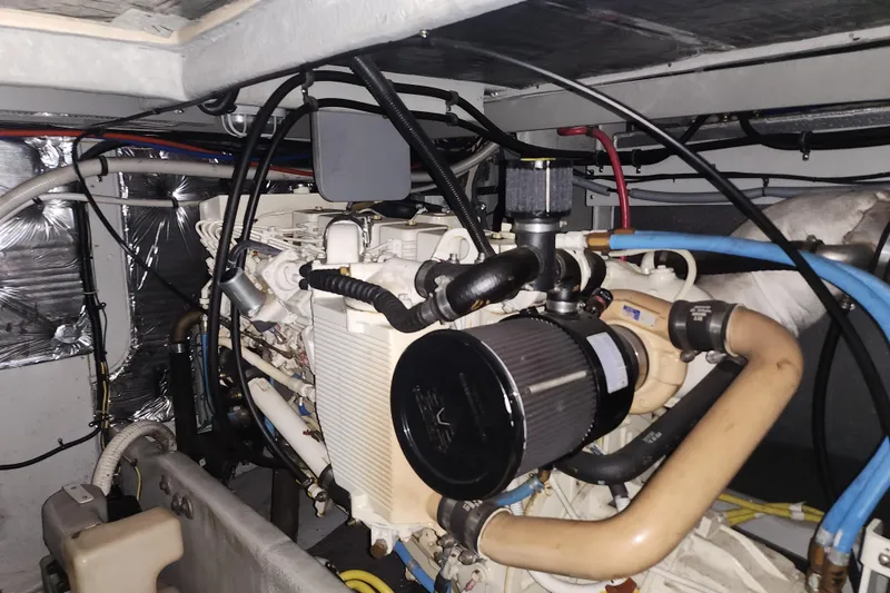 Slide: The Image of Engine room of a 2004 Meridian 411 Sedan yacht, showcasing mechanical components. - 42