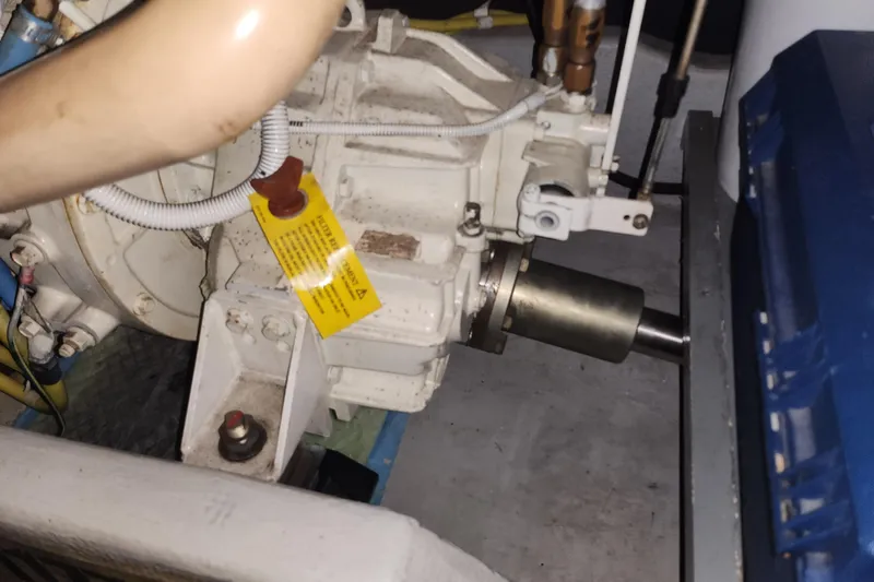 Slide: The Image of Engine compartment of a 2004 Meridian 411 Sedan with visible mechanical components. - 43