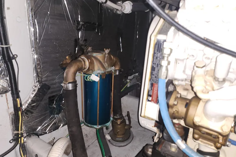 Slide: The Image of Engine room of a 2004 Meridian 411 Sedan, showcasing mechanical components and wiring. - 46