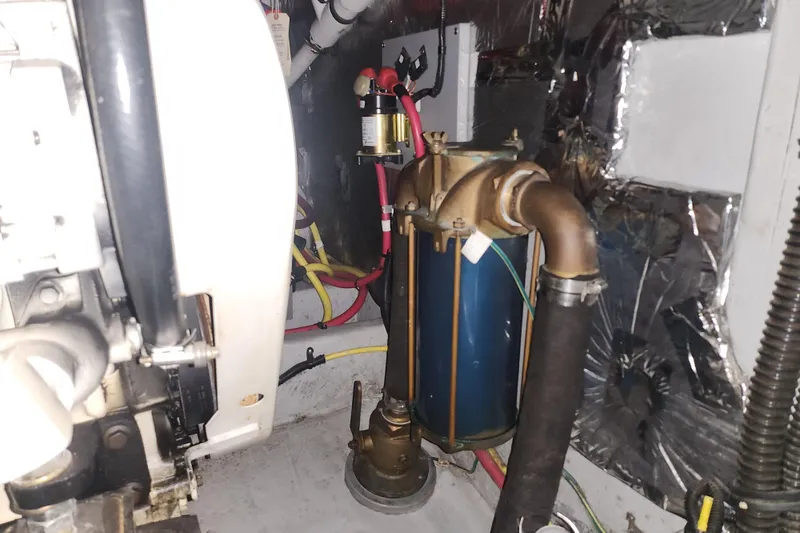 Slide: The Image of Engine room of a 2004 Meridian 411 Sedan with visible mechanical components. - 47