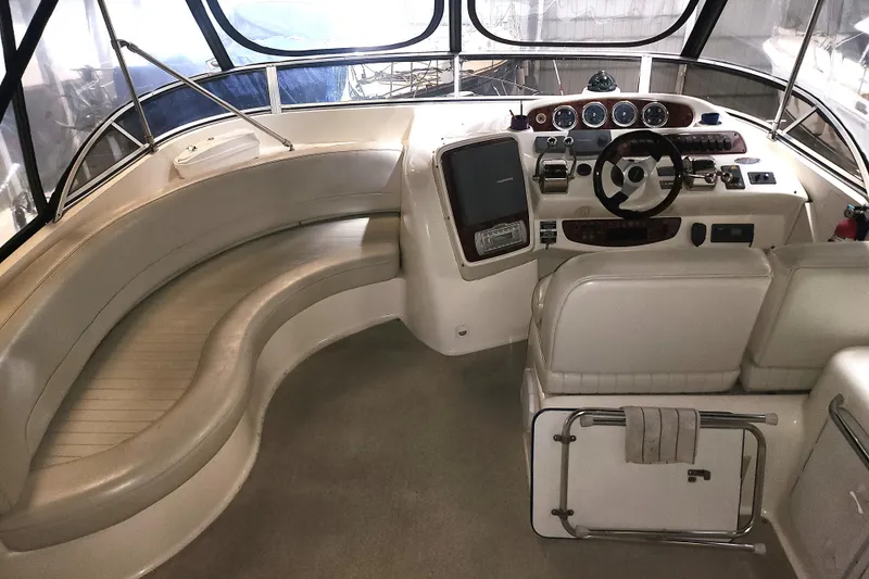 Slide: The Image of 2004 Meridian 411 Sedan yacht interior with helm, seating, and navigation controls. - 7