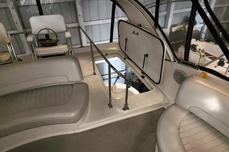 Slide: The Image of Interior view of a 2004 Meridian 411 Sedan yacht with seating and open hatch. - 8