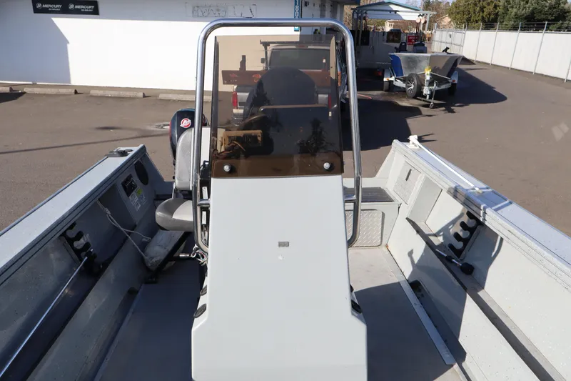 Slide: The Image of 2018 Smoker Craft Pro V Sportsman 2072 CC boat interior with console and seating. - 4