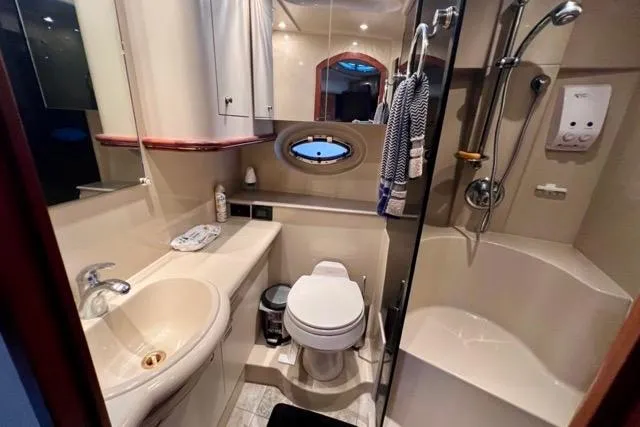 Slide: The Image of Luxurious bathroom in 2003 Cruisers Yachts 3772 Express with modern amenities and elegant design. - 22