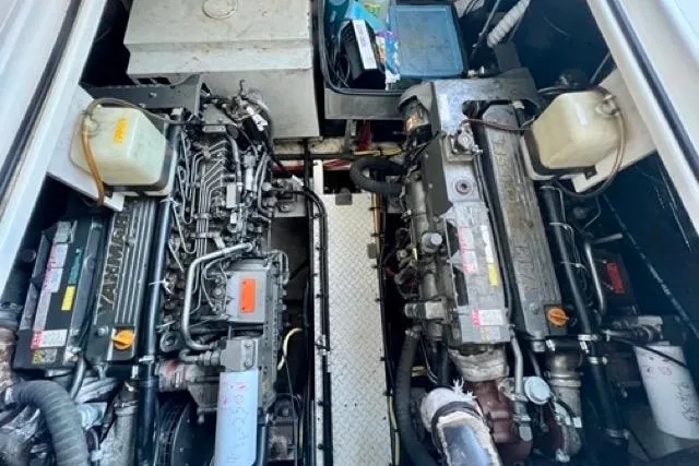Slide: The Image of Engine room of 2003 Cruisers Yachts 3772 Express with dual engines and mechanical components. - 26