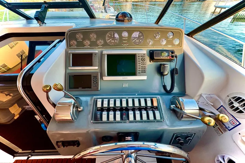 Slide: The Image of Control panel of a 2000 Tiara 37 Open boat with navigation instruments. - 10