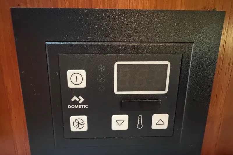 Slide: The Image of Dometic control panel on 2000 Tiara 37 Open boat, featuring temperature and fan settings. - 101