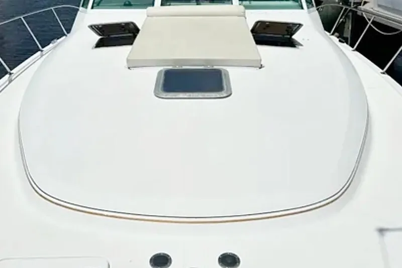 Slide: The Image of 2000 Tiara 37 Open yacht deck with sunpad and hatch. - 15