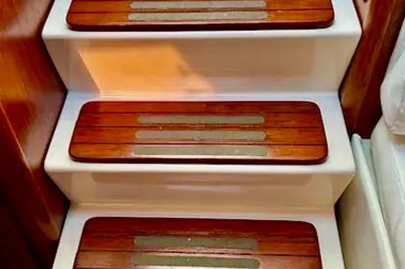 Slide: The Image of Wooden steps on a 2000 Tiara 37 Open yacht interior staircase. - 20
