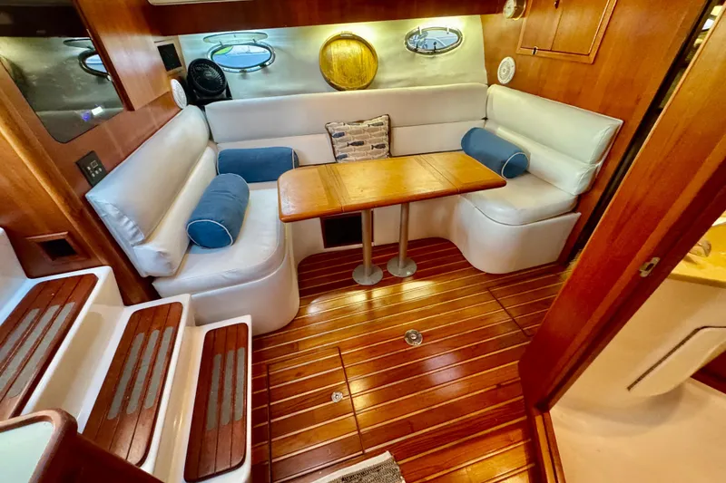 Slide: The Image of Luxurious interior of 2000 Tiara 37 Open yacht with wooden flooring and cozy seating. - 33
