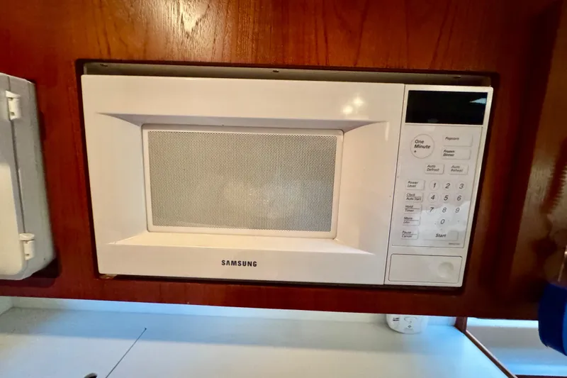 Slide: The Image of Samsung microwave in a 2000 Tiara 37 Open yacht kitchen setting. - 40