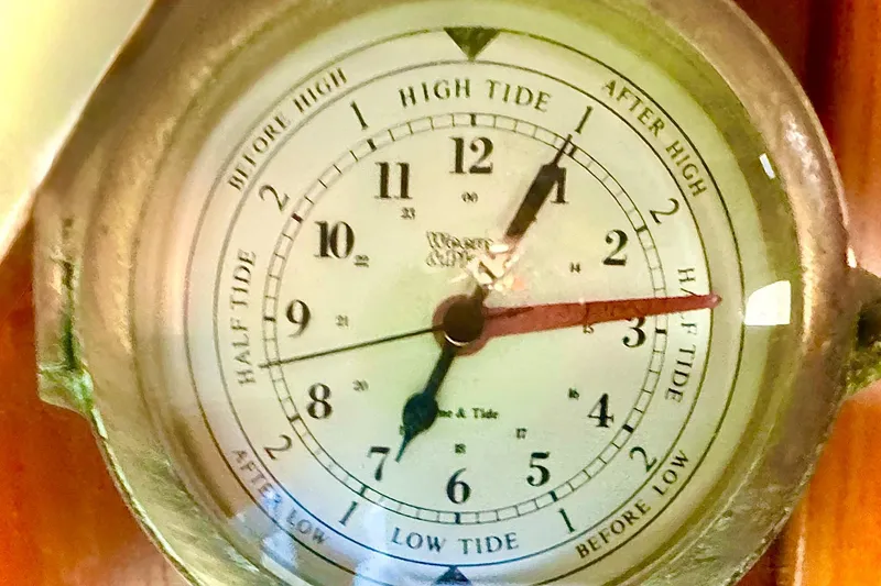 Slide: The Image of Nautical tide clock on a 2000 Tiara 37 Open boat, indicating high and low tides. - 57