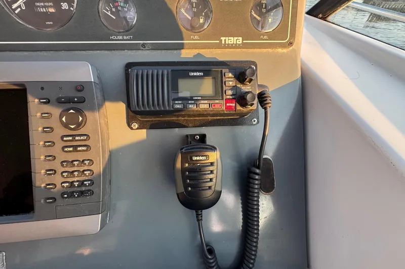 Slide: The Image of Control panel of a 2000 Tiara 37 Open boat with Uniden radio equipment. - 75