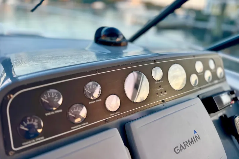 Slide: The Image of Dashboard of a 2000 Tiara 37 Open boat with Garmin navigation system. - 97