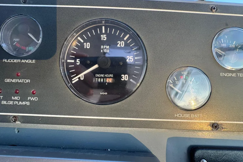 Slide: The Image of Dashboard of a 2000 Tiara 37 Open boat showing engine gauges and indicators. - 98