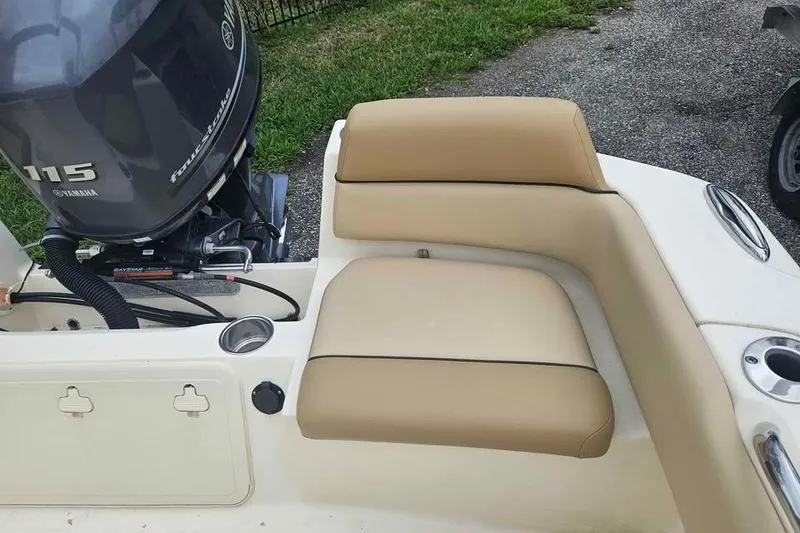 Slide: The Image of 2017 Scout 195 Sportfish boat with Yamaha 115 outboard motor and beige seating. - 11