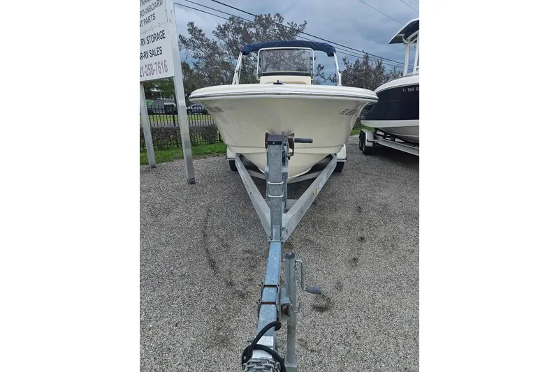 Slide: The Image of 2017 Scout 195 Sportfish boat on trailer, parked outdoors. - 4