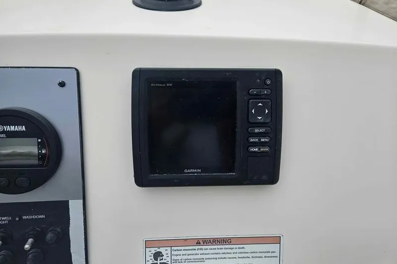 Slide: The Image of Control panel of a 2017 Scout 195 Sportfish boat with Garmin display and Yamaha gauge. - 8